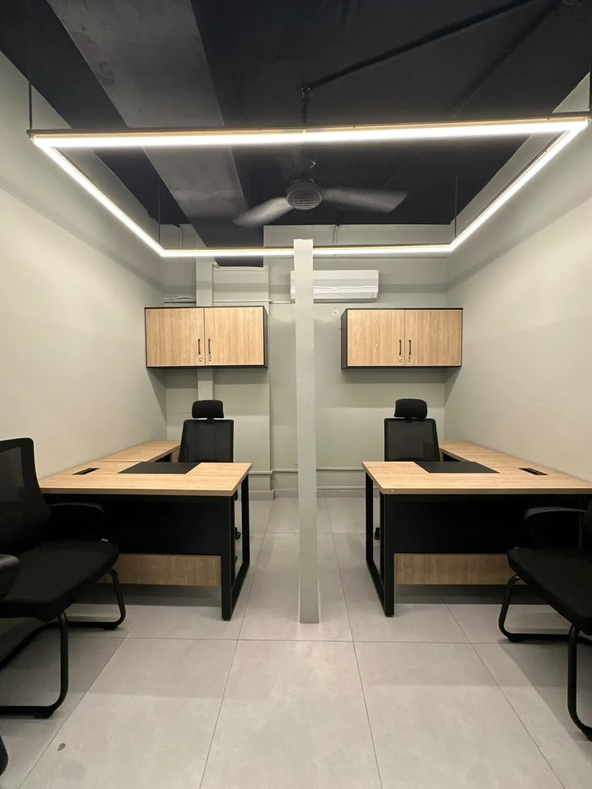 A private team office with four desks and wall storage at RSpace 59th Street